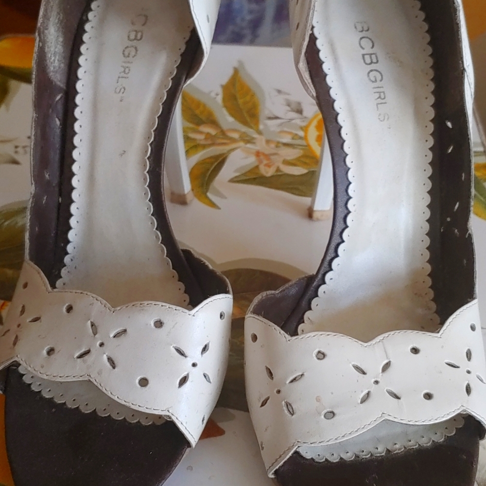 BCBG 100 % leather Heels. White open toes. Eyelet Design
